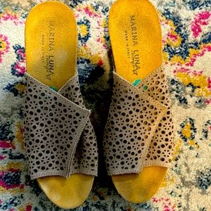 Beige slight wedge heel.